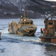 An image of amphibious vehicles on the sea